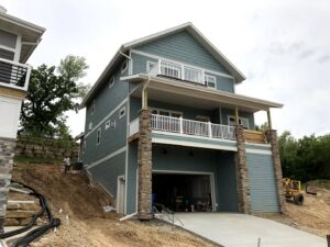 A house under construction with newly installed gutters and downspouts by Gutter Flow7 LLC in Madison, WI.