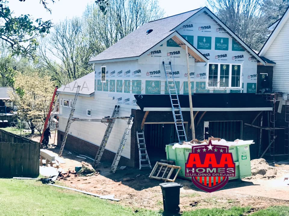 A house under construction with Typar wrap and ladders on site by AAA HOMES LLC in Franklin, TN.