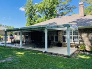 An exterior view of a house with a newly constructed covered patio or pergola by NRG Industries in Tallahassee, FL.