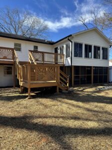 Exterior of a house with a newly built deck and screened porch addition by Contractor Kev LLC in Winston-Salem, NC