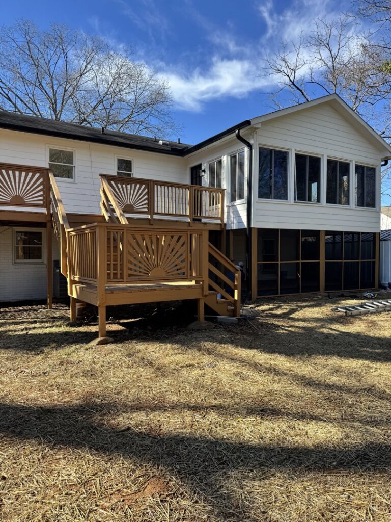 Exterior of a house with a newly built deck and screened porch addition by Contractor Kev LLC in Winston-Salem, NC