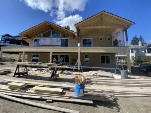 House exterior construction with siding and deck work by Precision Coatings LLC Siding and Painting Specialist in Tacoma, WA.