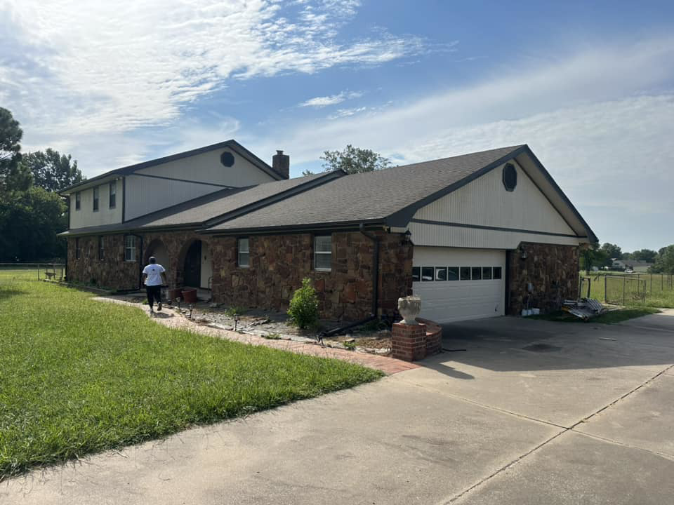 House exterior showing peeling siding and a ladder, indicating a handyman repair job by Construction Doctor in Littleton, CO.