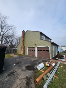 House exterior renovation with construction materials on site by The Best Larry Roofing corp in Mechanicsburg, PA