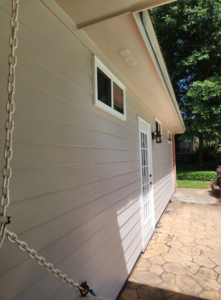 House exterior siding and door painting with a stamped concrete patio by Oseguera Painting, LLC in Tallahassee, FL