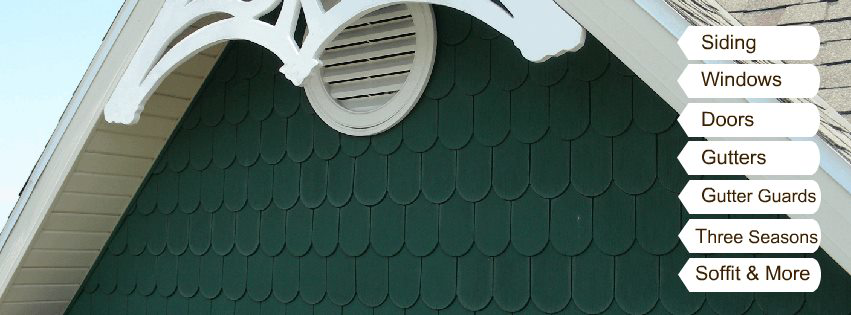 A house exterior showcasing green siding, white trim, and a gable vent, representing services offered by Neville's Inc. in Green Bay, WI.