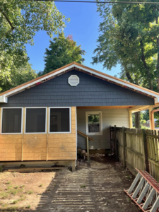 Exterior of a house with new siding and fascia installed during remodeling by R&R Foundation and remodeling in Owensboro, KY