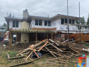 House exterior undergoing siding renovation by Precision Coatings LLC Siding and Painting Specialist in Tacoma, WA.