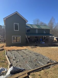 House exterior with new siding and windows being installed by Contractor Kev LLC in Winston-Salem, NC