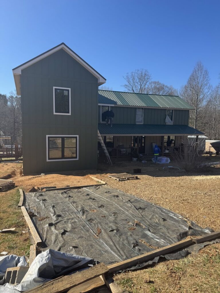 House exterior with new siding and windows being installed by Contractor Kev LLC in Winston-Salem, NC