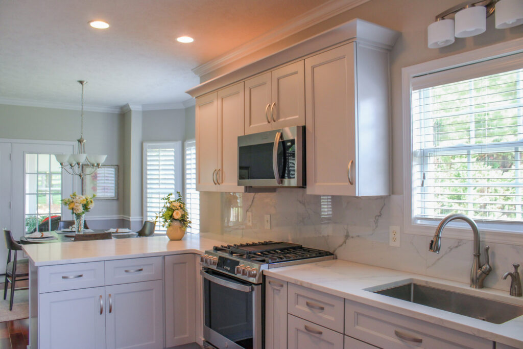 The exterior of a brick house with a newly installed white porch railing by Prestige Remodeling Solutions in Jackson, TN.