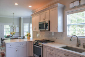 The exterior of a brick house with a newly installed white porch railing by Prestige Remodeling Solutions in Jackson, TN.