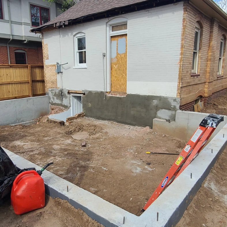 Exterior view of a house undergoing foundation repair and exterior patching by JL Harris Enterprises, LLC in Denver, CO