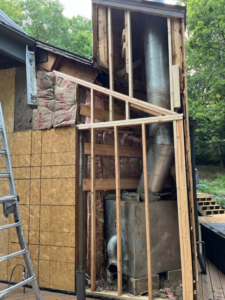House framing and insulation exposed during a repair project by Cedar Siding Repair in Centerville, OH.