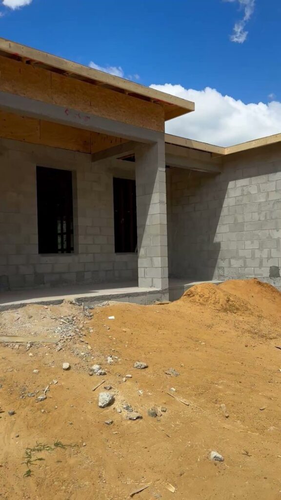 Residential construction showing concrete block walls and initial framing by Beyond Builders in Tampa, FL