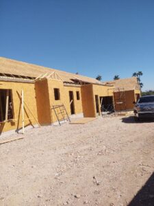 A house under construction with wood framing and OSB sheathing by AZ Framing and Remodeling in Peoria, AZ