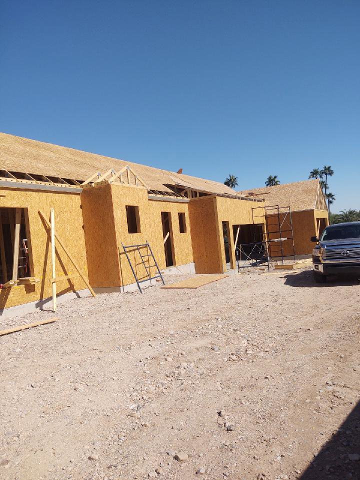 A house under construction with wood framing and OSB sheathing by AZ Framing and Remodeling in Peoria, AZ