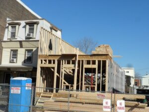 A residential house under construction with wood framing visible by EK Construction, LLC in Philadelphia, PA