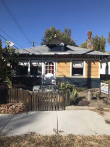 Front exterior of a house with updated wood siding and dark accents, a project by FES handyman services LLC in Boise, ID.