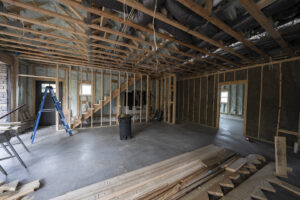 Interior of a house under construction showing framing, insulation, and ductwork by AB Insulation in Palmyra, NY.