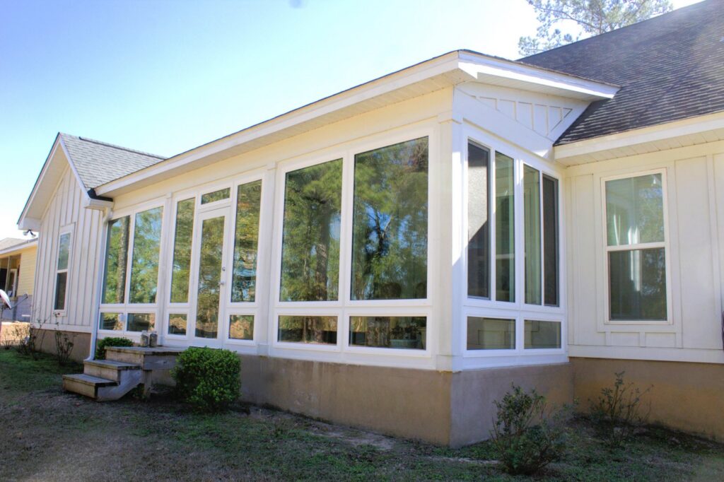 An impressive large sunroom addition on the side of a house, expertly built by NRG Industries in Tallahassee, FL.