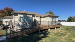 A house featuring a new deck and an accessibility ramp installed by Deckscape KC in Kansas City, MO.