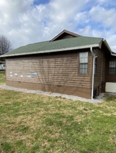 House with new gutters and updated siding, a home improvement project by Knoxville Guttering and Home Improvements in Knoxville, TN.