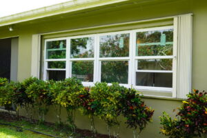 Exterior of a home with newly installed windows and shutters by FHIA Remodeling in Fort Lauderdale, FL