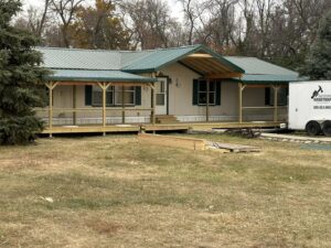 Residential house featuring a newly built wooden porch and veranda by Watertown Handyman in Watertown, SD.