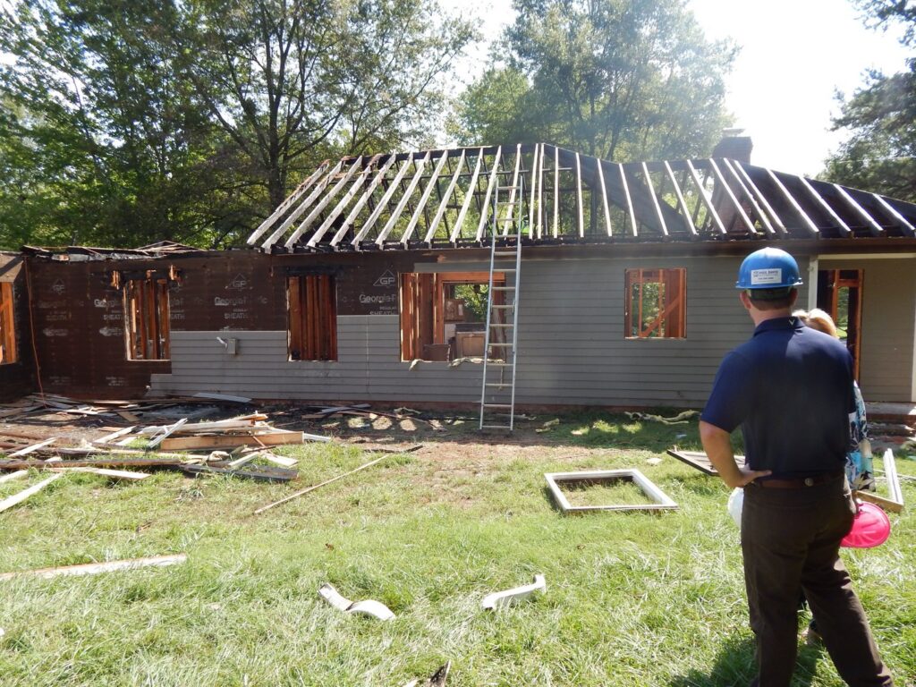 A house undergoing renovation with roof framing exposed by Paul Davis Restoration of Charlotte, NC.
