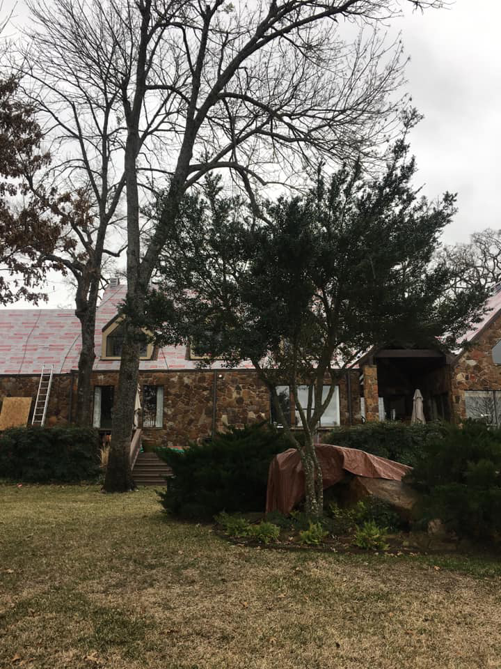 A residential house roof with red underlayment during a re-roofing project by TYCO Roofing & Construction LLC in Allen, TX.