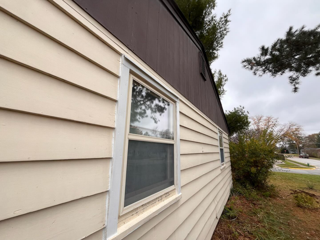 Side of a house featuring a newly installed window by McDonald Residential Contracting in Ames, IA.