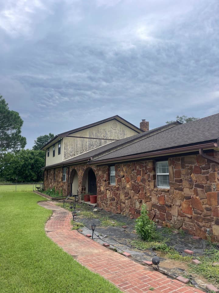 Side of a house with severely peeling paint and siding, a common exterior repair job for Construction Doctor in Littleton, CO.