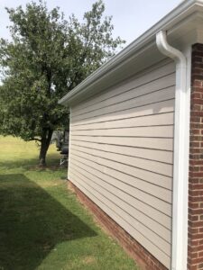 Freshly installed house siding and gutters on a home exterior by Lee's Painting in Northbrook, IL