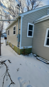 House siding repair and electrical meter area work by Clausen Construction LLC in Williston, ND