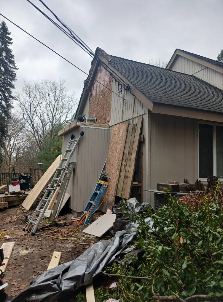 House siding repair and exterior renovation in progress by Exterior Renovations, LLC in Clinton Township, MI.