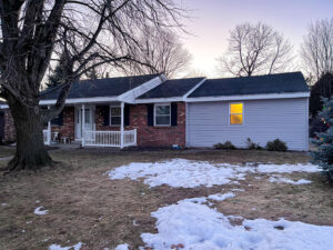 A residential home with newly installed siding and a new roof by L12 Construction LLC in Oshkosh, WI.