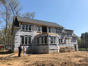 An exterior view of a house under construction, wrapped in Tyvek, by Midlothian, Inc. in Kenbridge, VA.