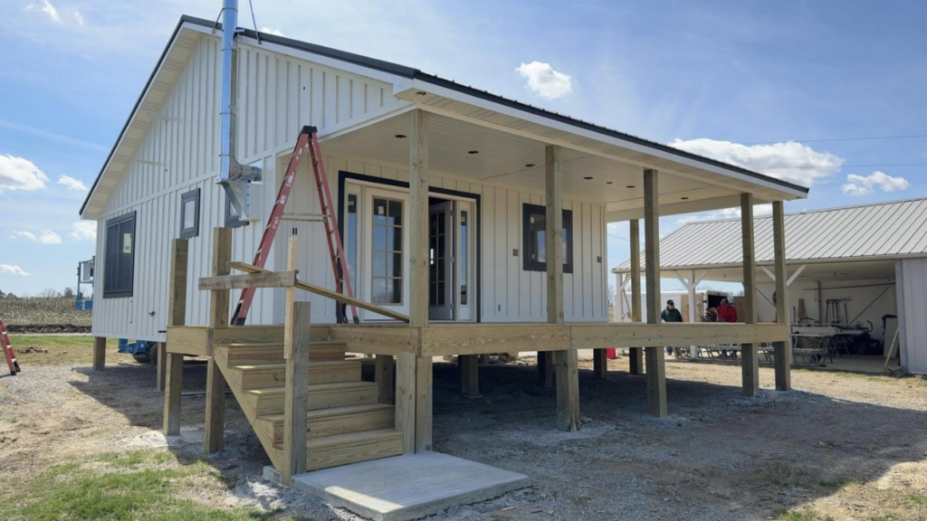 A house under construction featuring a new wooden deck, stairs, and covered porch by Phillip's Home Repair in Owensboro, KY