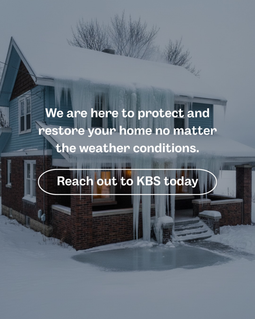 A house covered in heavy snow and large icicles, indicating ice dam issues, a common handyman service provided by KBS Construction & Remodeling in Minneapolis, MN.