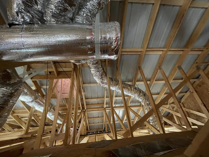 HVAC ductwork being installed in an attic by ThermaPros in Leesburg, FL.