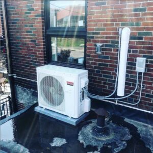 An outdoor HVAC unit professionally installed on a rooftop by Paul Bergeron Jr. Contracting Inc. in Worcester, MA
