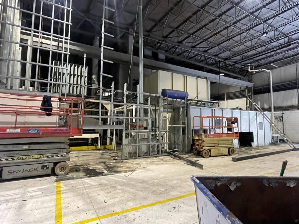 Industrial equipment and scaffolding during a decommissioning project by Remove Recycle Remarket in Troy, MI.
