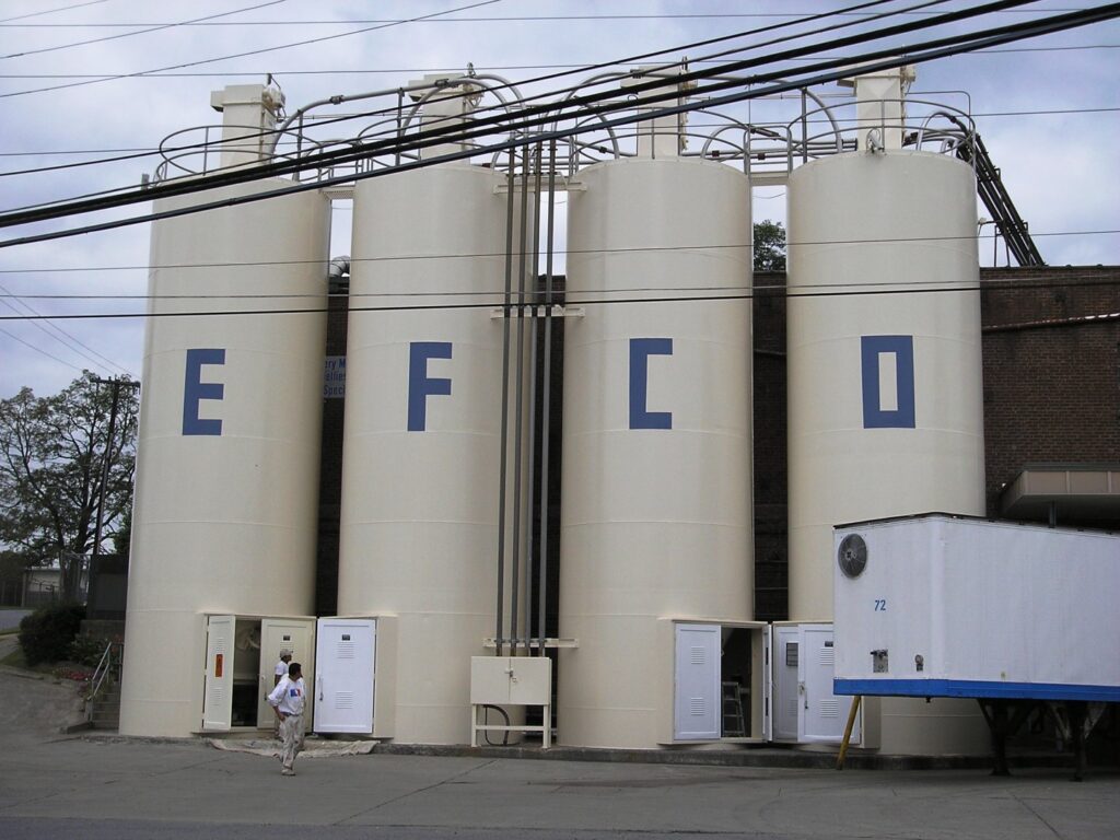 Industrial silos receiving exterior painting and maintenance from Alpine Painting and Sandblasting Contractors in Paterson, NJ.