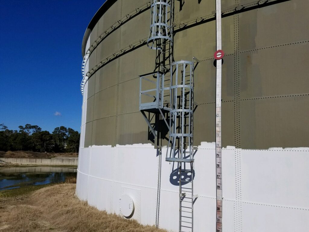 A large industrial tank with painting in progress by WW Enroughty & Son, Inc. in Richmond, VA.