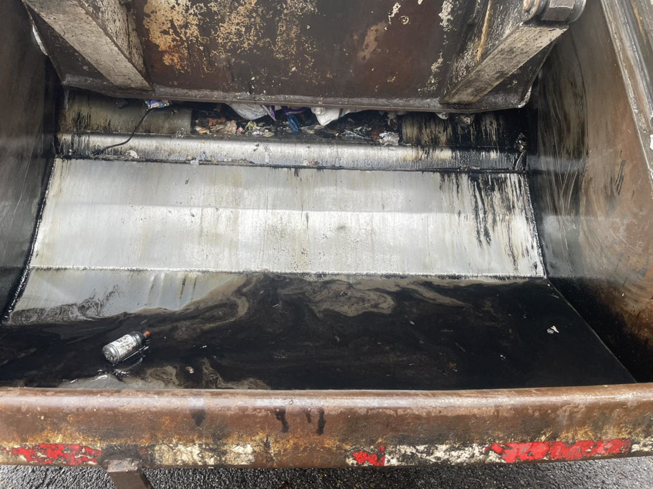 The interior of a waste truck compactor with collected junk at Waste To Geaux in Pineville, LA