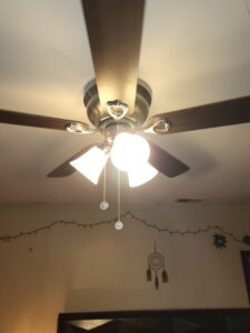 Newly installed ceiling fan with lights in a room by Green Man's Contracting & Landscaping LLC in West Hartford, CT.