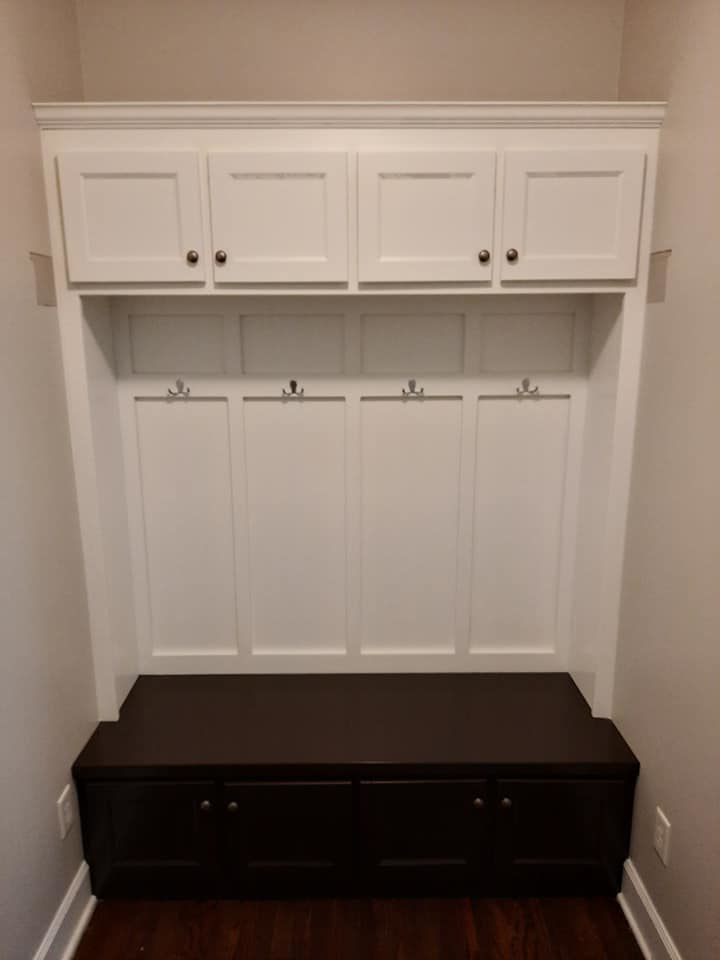 An installed custom wood mudroom built-in unit by Don's Custom Woodwork in Jefferson City, MO.