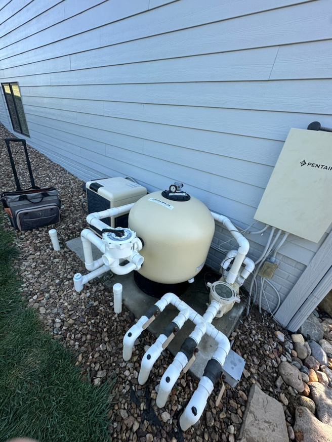 A professionally installed pool pump and filter system by Titan Handyman, LLC in Lewes, DE.