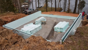 An insulated concrete form foundation under construction with building materials on site by Central Enterprises in Clifton, IL.